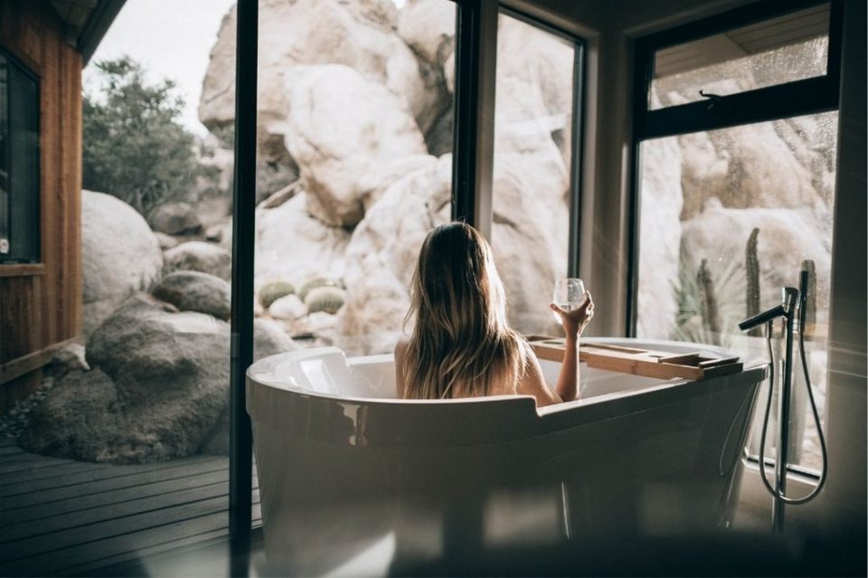 spa bathroom with a view of the mountains